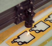 Die cutting tape adhesive solutions for laser